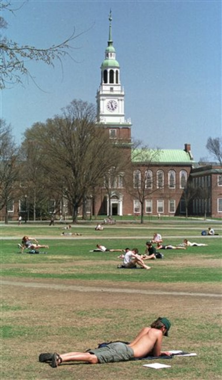 FILE - In this May 1, 2001 file photo, Dartmouth College students lounge on a lawn on the campus in Hanover, N.H.  Two of the nation's most selective private colleges, Dartmouth and Williams, announced they would no longer offer financial aid packages that allow students of any income to attend without taking out loans. Other schools are expected to follow suit, forcing many middle-class students to take on more debt. (AP Photo/Lee Marriner, File)